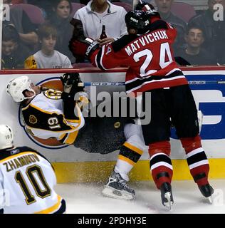 Ottawa Senators Jason Spezza (19) tries to shoot the puck past a diving New  Jersey Devils Richard Matvichuk (24) in the second period at the  Continental Airlines Arena in East Rutherford, New