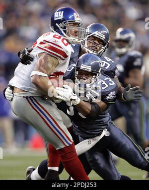 New York Giants Jeremy Shockey and Eli Manning (right) watch the action  from the bench in the fourth quarter. The Vikings defeated the Giants  41-17, at Giants Stadium in East Rutherford, New