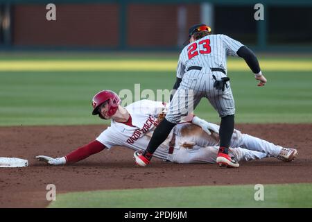 Steal Second. 14th Mar, 2023. Arkansas base runner Hudson Polk #16 is tagged out by UNLV infielder Paul Myro #23 as he attempts to steal second. Arkansas defeated UNLV 13-7 in Fayetteville, AR, Richey Miller/CSM/Alamy Live News Stock Photo