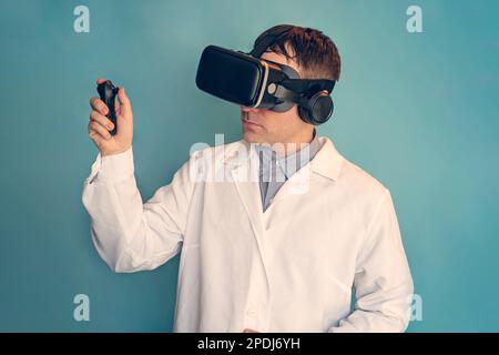 Medical doctor using virtual reality headset at his work. a doctor in a VR helmet on a blue background. telemedicine concept Stock Photo