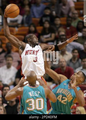 Miami Heat's P.J. Brown (42) covers Atlanta Hawks' Christian Laettner (32)  as he drives to the net during NBA action in Miami Tuesday, Jan. 21, 1997.  (AP Photo/Hans Deryk Stock Photo - Alamy