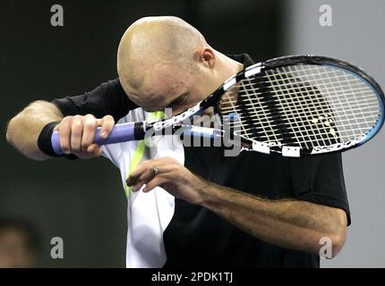 World's number one player, Switzerland's Roger Federer prepares to serve a  ball against Argentina's David Nalbandian (unseen) during the opening match  for the Shanghai Tennis Masters Cup held at the Qi Zhong