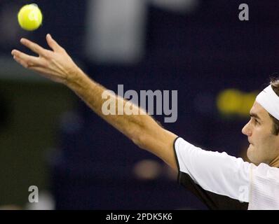 World's number one player, Switzerland's Roger Federer prepares to serve a  ball against Argentina's David Nalbandian (unseen) during the opening match  for the Shanghai Tennis Masters Cup held at the Qi Zhong