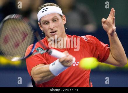World's number one player, Switzerland's Roger Federer prepares to serve a  ball against Argentina's David Nalbandian (unseen) during the opening match  for the Shanghai Tennis Masters Cup held at the Qi Zhong
