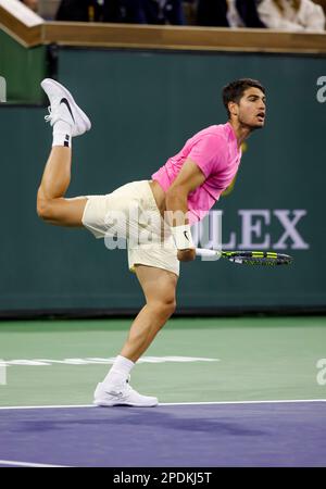 Carlos Alcaraz, of Spain, serves to Jack Draper, of Great Britain, during their semifinals match