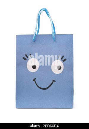Front view of blue paper shopping bag with smiling funny face  isolated on white Stock Photo