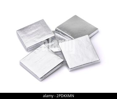 Group of silver foil wrapped square chocolate bars  isolated on white Stock Photo