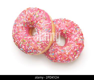 Top view of two pink glazed donuts with colorful sprinkles isolated on white Stock Photo