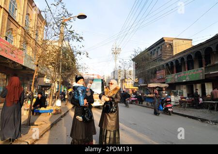 Walking in the old city in Kashgar, Xinjiang, China. Stock Photo