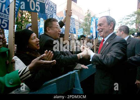 Supporters of mayoral candidate Fernando Ferrer, second left, clamour for a  chance to greet Ferrer and former President Bill Clinton as they campaign  together in the Bronx borough of New York Thursday