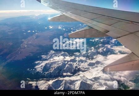 Pikes Peak and the Rocky Mountains west of Colorado Springs, Colorado by view of an airplane flight. Stock Photo