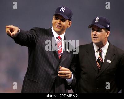 Seattle Mariners greats Edgar Martinez, left, and Ken Griffey Jr. pose for  photos after they raised a flag for the 2023 All-Star Game on the roof of  the Space Needle, Thursday, Sept.