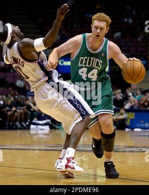 Boston Celtics Brian Scalabrine 44 runs into New Jersey Nets Jeff McInnis during the fourth quarter Tuesday night Oct. 25 2005 in East Rutherford N.J. Scalabrine was called for an offensive foul. The ...