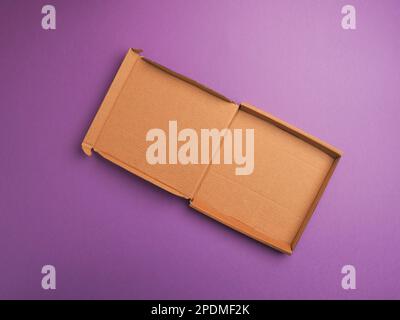 Eco friendly pizza box on a purple studio background using as food template Stock Photo