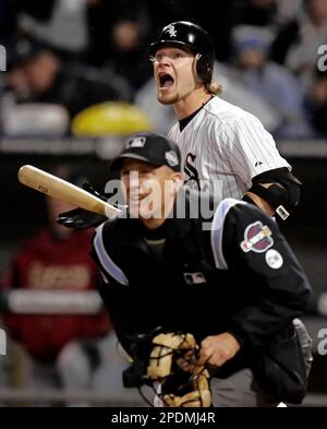 Chicago White Sox's Joe Crede, left, gets a cleat to the neck as