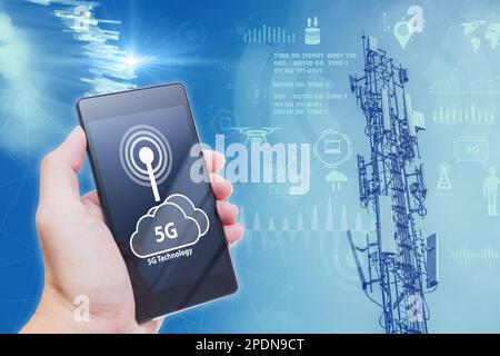 5G data communication tower overlay with Smartphone connect to high speed network cell site Stock Photo