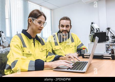 software engineering team working together in robotic technology lap for research and develop for manufactory process Stock Photo