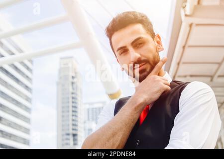 portrait happy smile hispanic latin business young man smart look handsome action model closeup outdoors Stock Photo