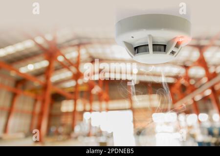 Fire Alarms for Warehouse Smoke Detector Fire Detector safety device setup at Cargo Storage Area ceiling Stock Photo