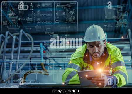 Smart Engineer learning new mechanical design from internet tablet for wisdom rising work in Gas Pipe Industry Stock Photo