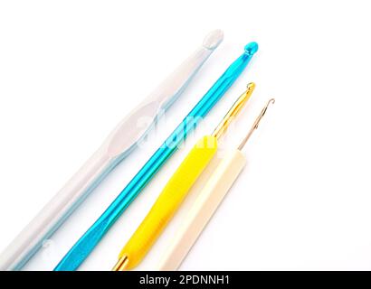 Different size crochet hooks for knitting isolated on white background Stock Photo
