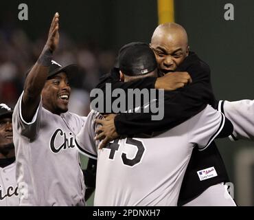 Chicago White Sox Orlando El Duque Hernandez (black jacket) hugs