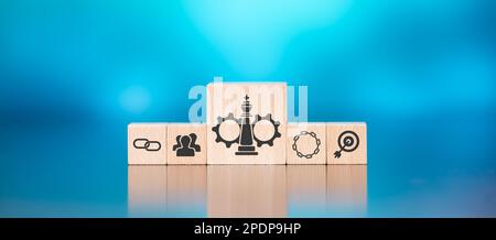 Wooden blocks with symbol of strategic alliance concept on blue background Stock Photo