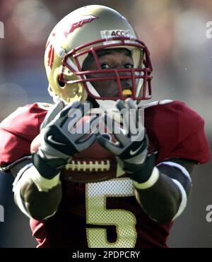 Florida State receiver Chris Davis, right, runs past North