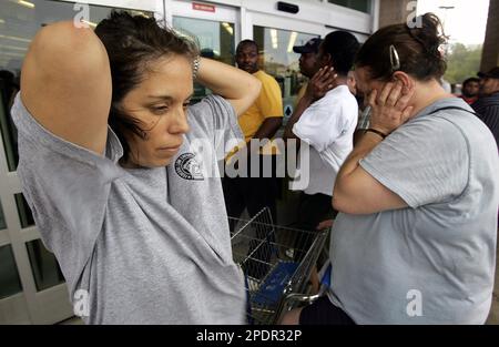 Darlene Pelaez left of Beaumont Texas stands frustrated