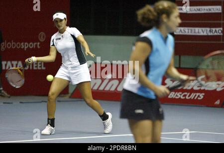 India's Sania Mirza plays a forehand against Germany's Martina Muller