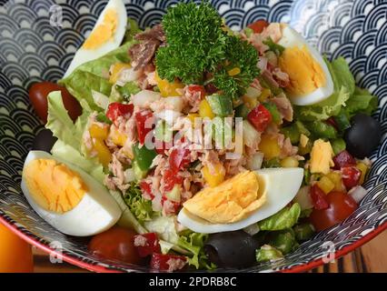 Nicoise salad in bowl close up side view for restaurant menu Stock Photo