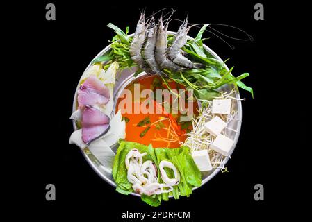 Korean hot pot with raw seafood on black background Stock Photo