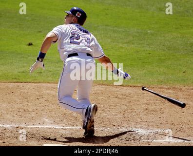 Texas Rangers Mark Teixeira runs out of the batters box after hitting a  double off of Cleveland Indians pitcher Cliff Lee that scored Alfonso  Soriano and Michael Young in the third inning