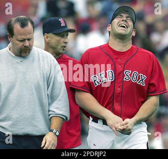 Boston Red Sox manager Terry Francona, left, grabs the shirt of