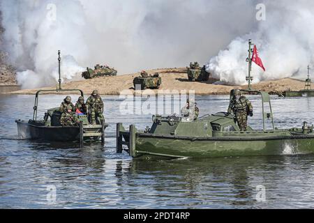 March 13, 2023, YEONCHEON, GYEONGGI, SOUTH KOREA: March 15, 2023-Yeoncheon, South Korea-Military vehicles cross a makeshift bridge assembled by South Korean and U.S. troops during combined river-crossing drills at a training ground in the border county of Yeoncheon, 62 kilometers of Seoul, in this photo provided by the South's Army on March 15, 2023. The drills kicked off on March 6 and will run until March 17. South Korea and the United States are conducting combined river-crossing military drills in a border county, the Army here said Wednesday, as part of the allies' ongoing springtime exer Stock Photo