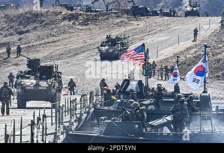 March 13, 2023, YEONCHEON, GYEONGGI, SOUTH KOREA: March 15, 2023-Yeoncheon, South Korea-Military vehicles cross a makeshift bridge assembled by South Korean and U.S. troops during combined river-crossing drills at a training ground in the border county of Yeoncheon, 62 kilometers of Seoul, in this photo provided by the South's Army on March 15, 2023. The drills kicked off on March 6 and will run until March 17. South Korea and the United States are conducting combined river-crossing military drills in a border county, the Army here said Wednesday, as part of the allies' ongoing springtime exer Stock Photo