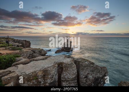 Sunset behind the rock stack at Cabo Carvoeiro with stormy sea, Peniche, Central Region, Portugal, Europe Stock Photo