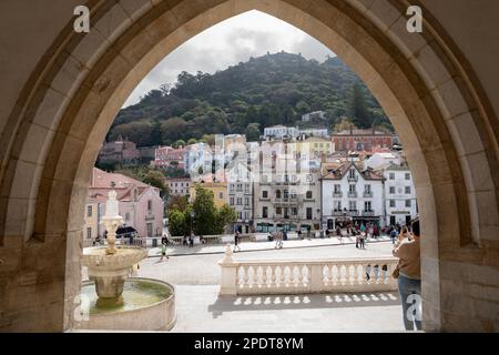 Largo Rainha Dona Amelia square with the Moorish Castle on hill viewed through arch at the Sintra National Palace, Sintra, Lisbon Region, Portugal, Eu Stock Photo