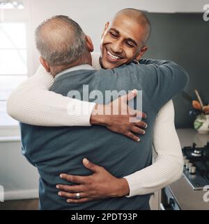 Family, hug or son with senior father for Fathers Day love, home bond or embrace in modern kitchen. Smile, happiness or support care from Mexico dad Stock Photo