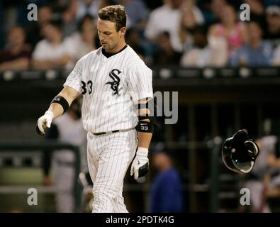 Chicago White Sox's Aaron Rowand (33) greets Geoff Blum (27) after Blum  crossed the plate after hitting a solo homer during the 14th inning in game  3 of the World Series, October