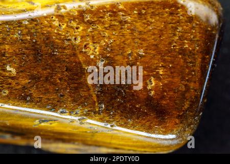 Natural mineral stone tiger eye gemstone. Close up, macro Stock Photo