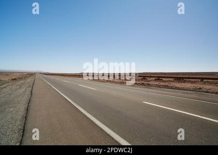 Chile, Atacama desert - long empty straight road through the desert. Stock Photo