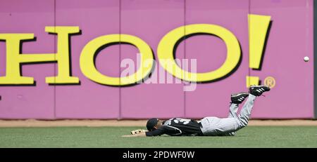 Colorado Rockies center fielder Cory Sullivan falls after missing a fly ball hit by San Francisco Giants' Lance Niekro during the seventh inning in San Francisco, Wednesday Aug. 31, 2005. Niekro reached third for a triple on the play. The Giants won 5-3.(AP Photo/Eric Risberg)