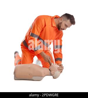 Paramedic in uniform practicing first aid on mannequin against white background Stock Photo