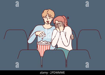 Guy and girl are watching horror movie in cinema and eating popcorn enjoying films about vampires. Fearful woman closes eyes with hands sitting in cinema near man watching horror movie with interest  Stock Vector