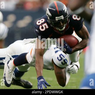 Denver Broncos wide receiver Ashley Lelie, front, juggles the ball before  dropping it as he is hit by Washington Redskins cornerback Ade Jimoh during  the fourth quarter of the Broncos' 21-19 victory