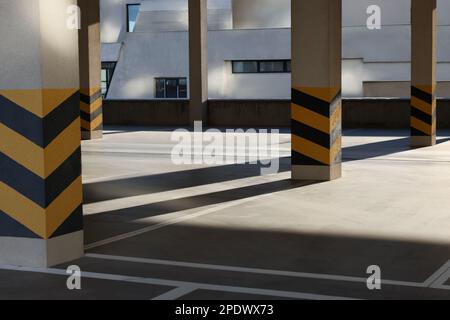 Empty open car parking garage on sunny day Stock Photo