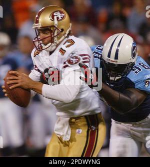 San Francisco Forty Niners quarterback Tim Rattay feels the pressure of St.  Louis Rams Damione Lewis, #92 and Leonard Littlel in the 2nd quarter of  their game at Monster Park in San