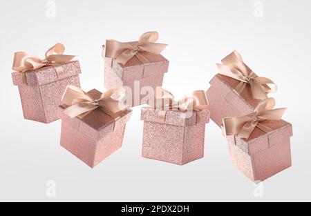 Beautifully wrapped gift boxes flying on white background Stock Photo