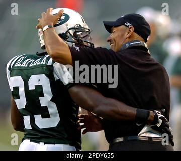 New York Jets coach Herman Edwards (L) acknowledges Head coach